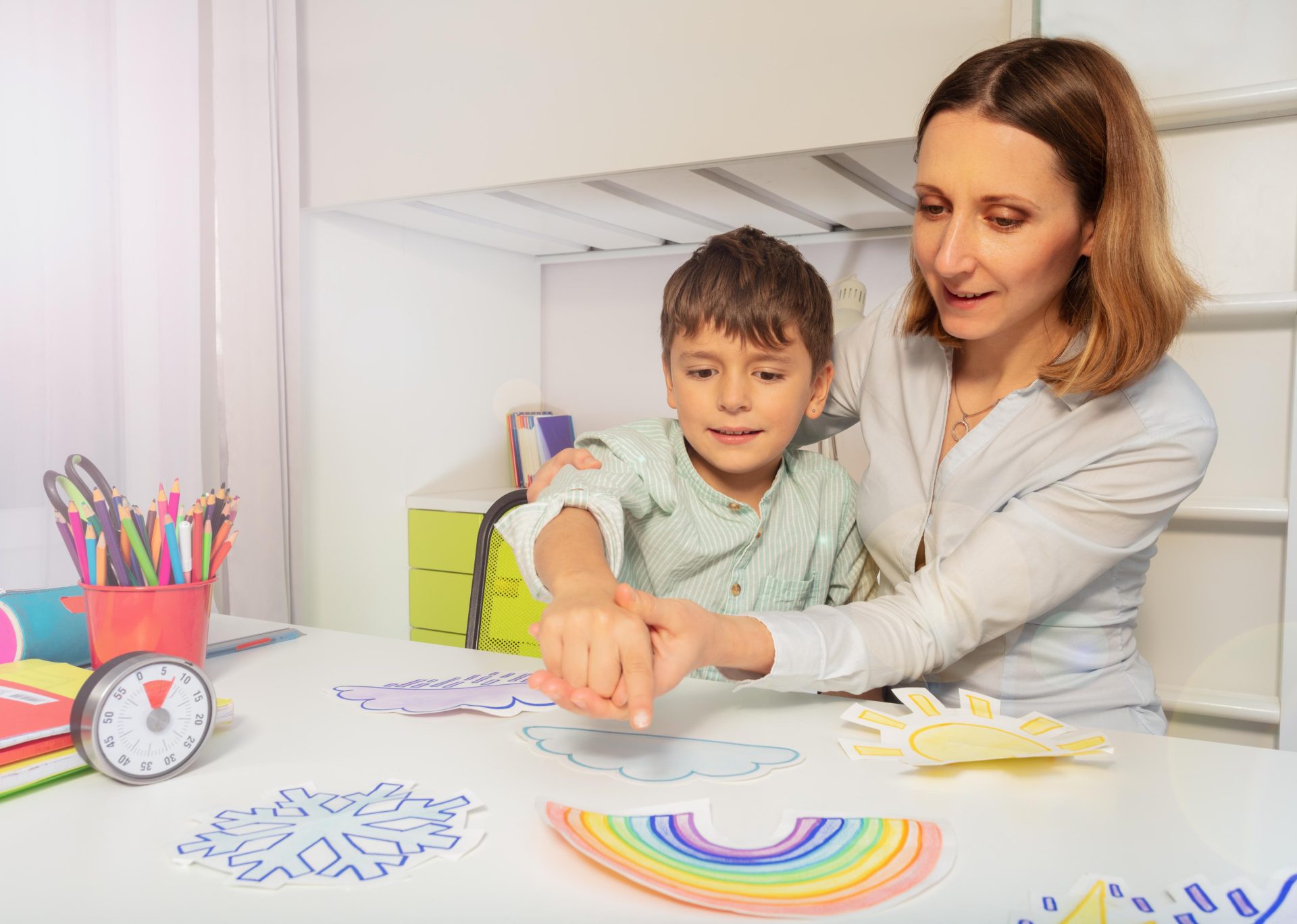 Child being helped by tutor